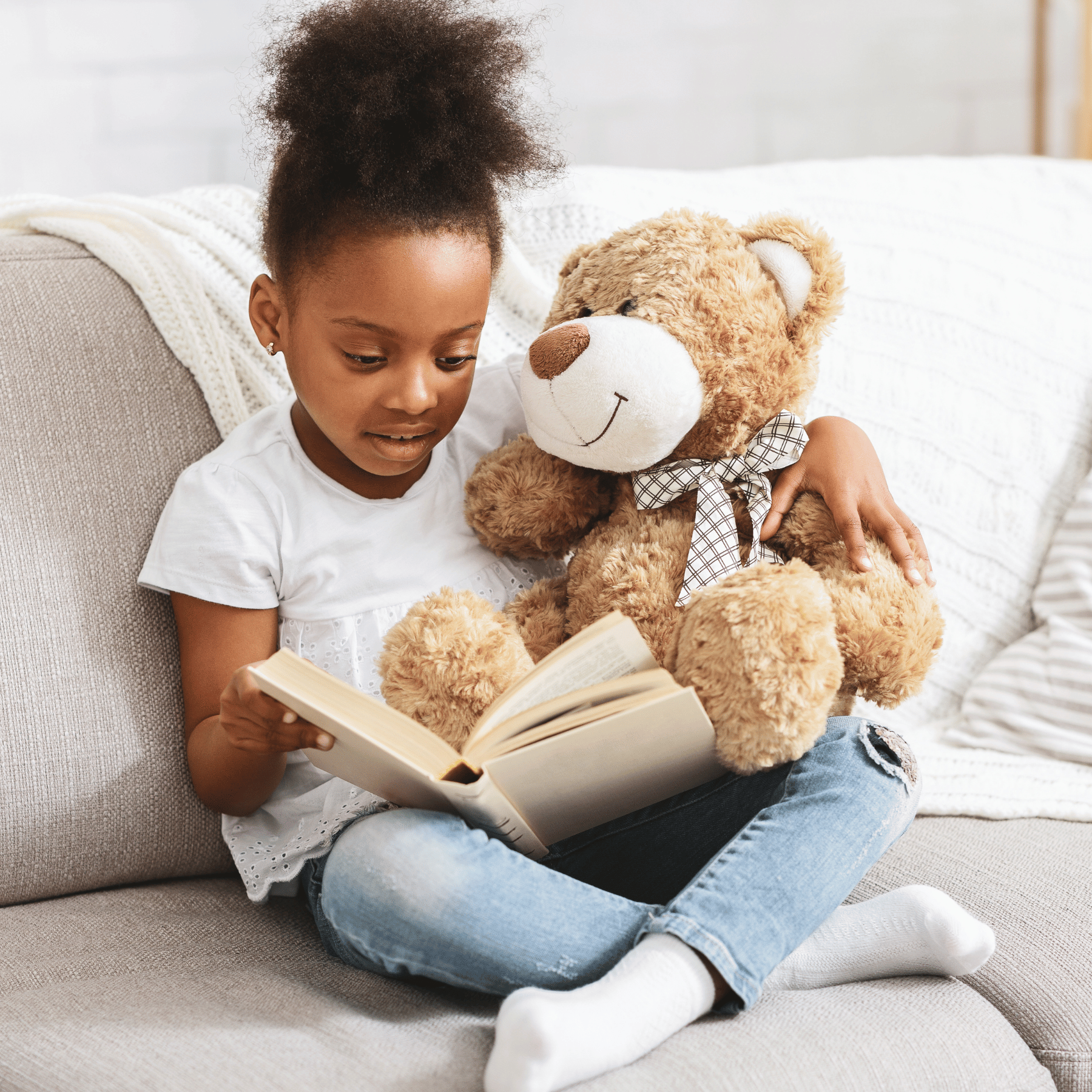 girl reading with plush animals, reading buddy a thon 